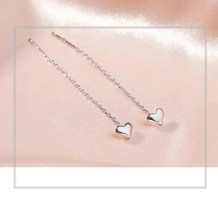 Heart-Shaped Earrings with a Delicate Dangling Design: silver heart, minimal style