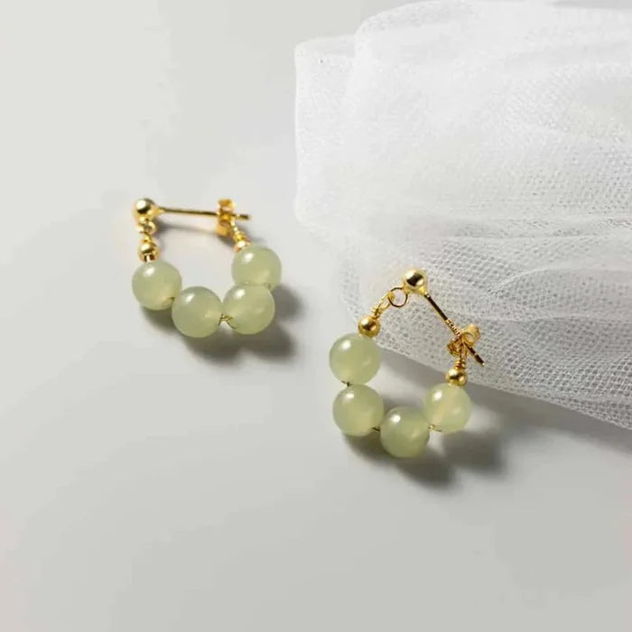 Hoop Earrings with Jade Beads: pale translucent yellow-green, gold pair of hoop earrings, minimal style