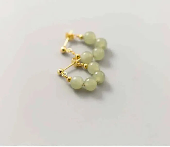 Hoop Earrings with Jade Beads: pale translucent yellow-green, gold pair of hoop earrings, minimal style