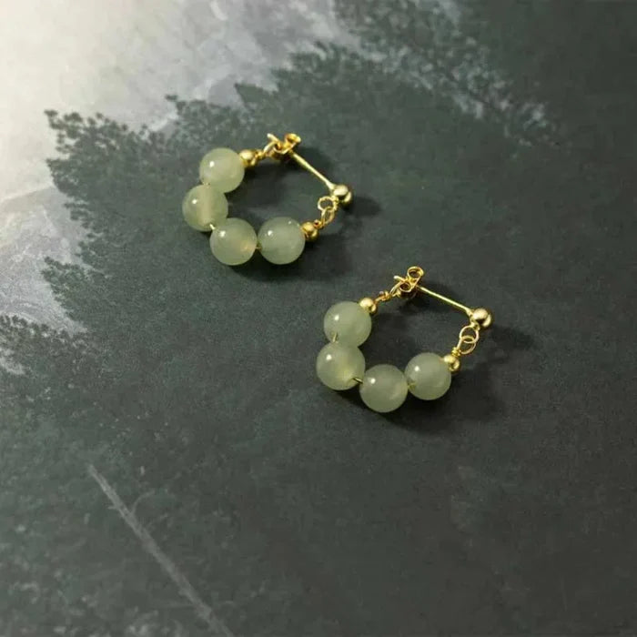 Hoop Earrings with Jade Beads: pale translucent yellow-green, gold pair of hoop earrings, minimal style