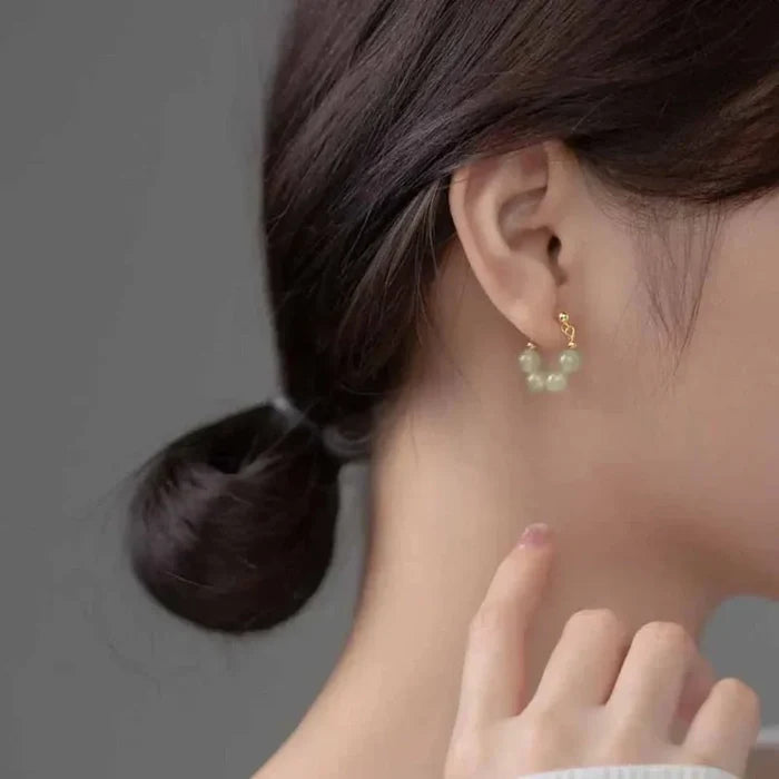 Hoop Earrings with Jade Beads: pale translucent yellow-green, gold pair of hoop earrings, minimal style