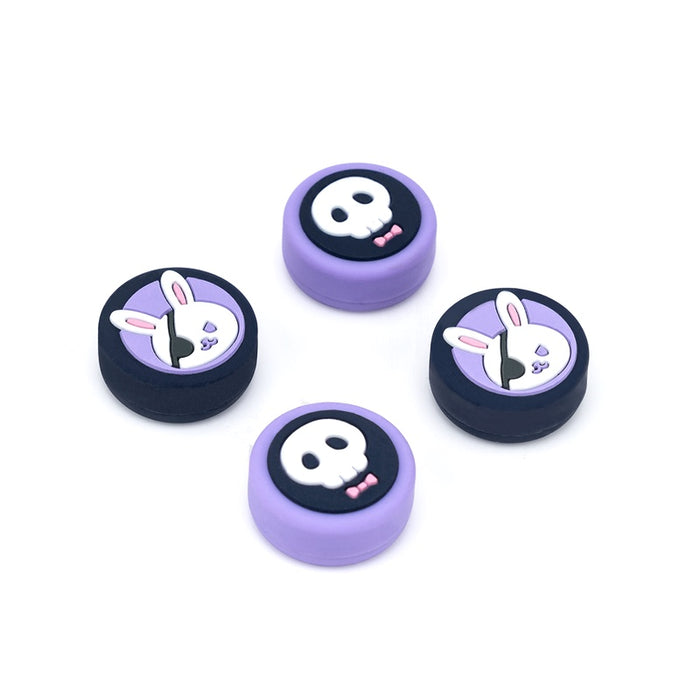 Kawaii Animal Design Switch Thumb Grips: pastel pink, black bunny and skull/cartoon character theme, kawaii cartoon style