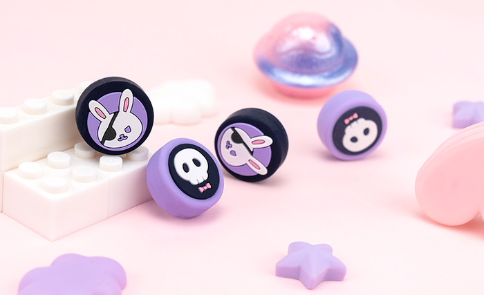 Kawaii Animal Design Switch Thumb Grips: pastel pink, black bunny and skull/cartoon character theme, kawaii cartoon style