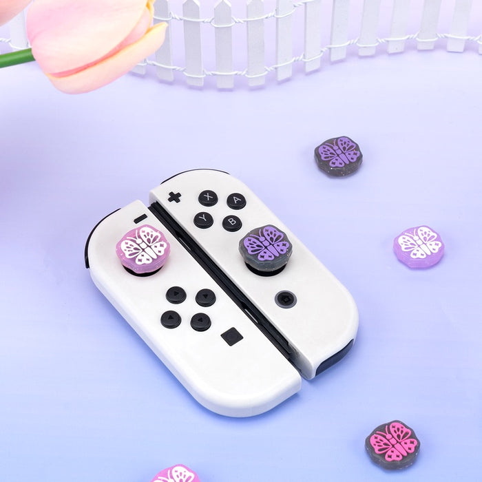 Kawaii Glitter Butterfly Joy-Con Caps: white, black butterfly theme, cute pastel gaming accessory style