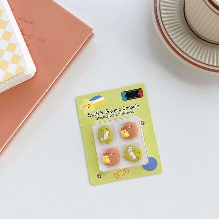 Kawaii Switch Thumb Grips with Joystick Caps: light blue, yellow Pikachu-like yellow character faces and blue bows, cute cart