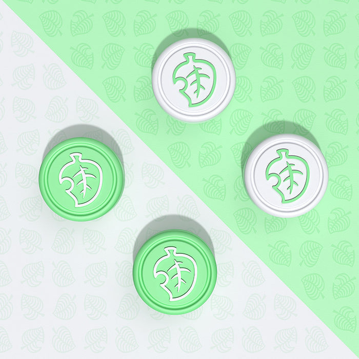 Kirby-themed Joystick Caps for Switch: mint green, white leaf emblem, minimal graphic style