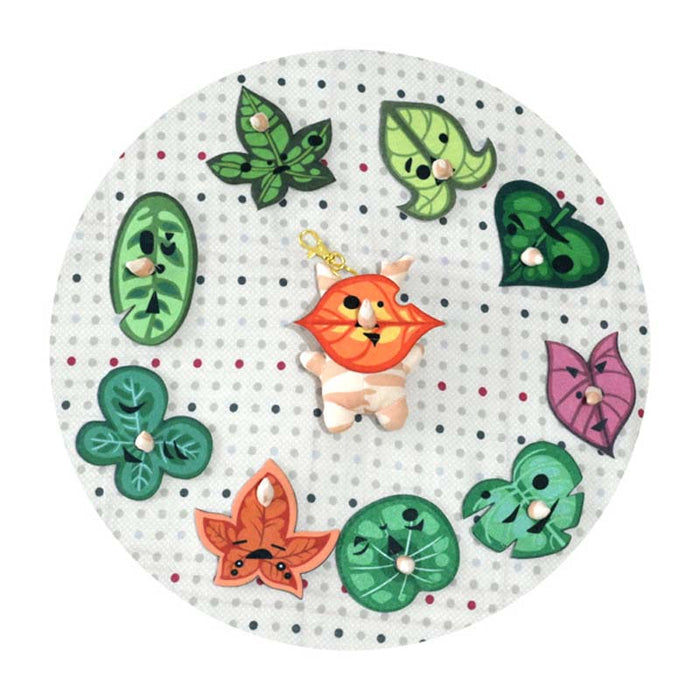 Korok Plushies with Interchangeable Faces and Sound: green, orange cartoon orange animal character with green leaf characters