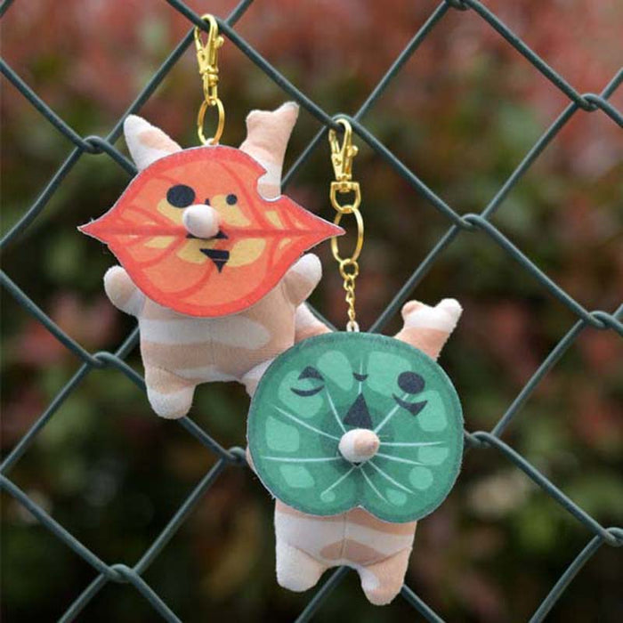 Korok Plushies with Interchangeable Faces and Sound: green, orange cartoon orange animal character with green leaf characters