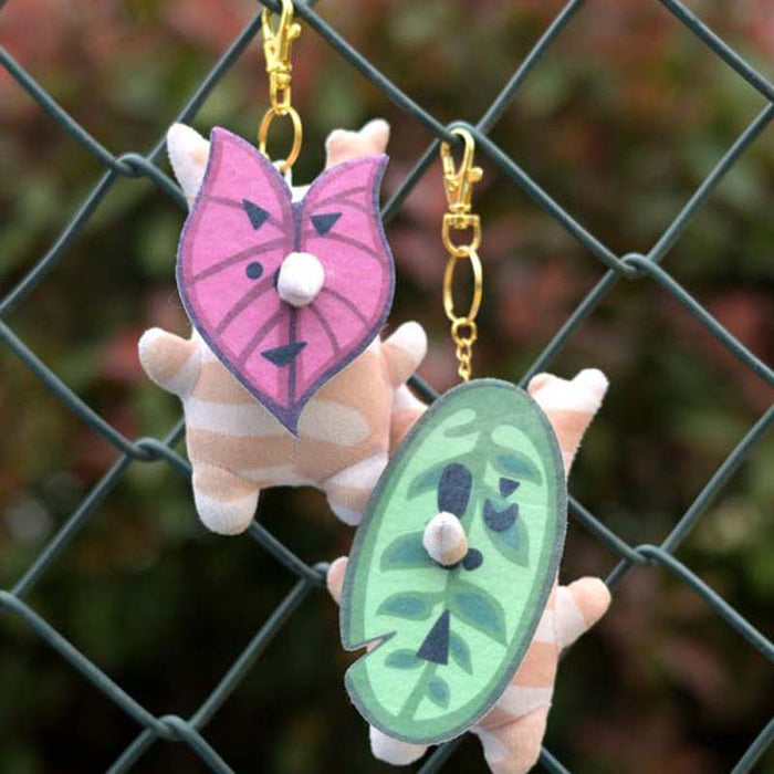 Korok Plushies with Interchangeable Faces and Sound: green, orange cartoon orange animal character with green leaf characters