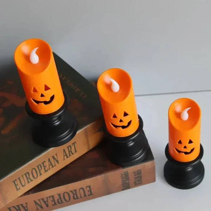 LED Electronic Candle with Halloween Pumpkin Design: orange, black carved jack-o'-lantern pumpkins, Halloween, spooky decorat