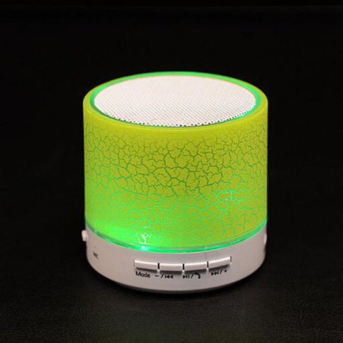 LED Mini Bluetooth Speaker, Portal Edition: bright green, white portable speaker with USB charging cable, minimal modern styl