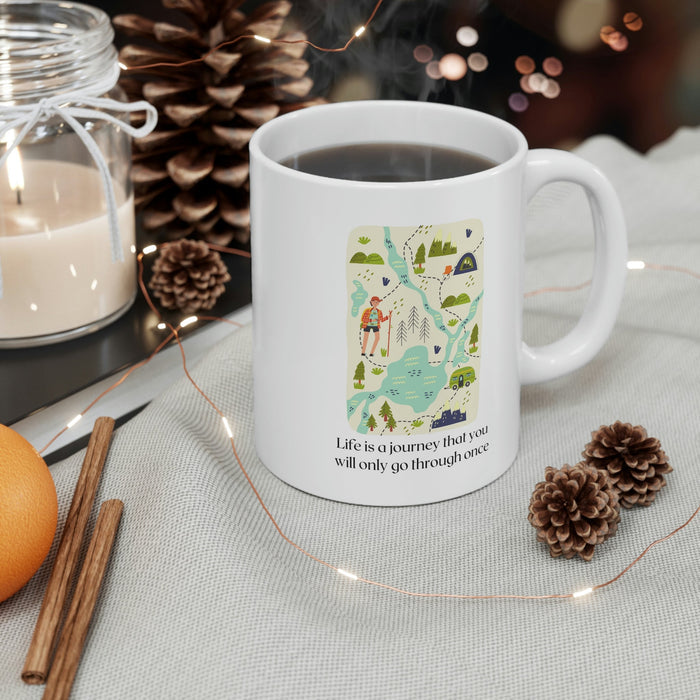 Life's Voyage Coffee and Tea Mug: white, green outdoor travel/camping theme, cartoon illustrated style