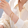 Multi-Strand Charm Bracelet for a Fashionable Stacked Style: gold bracelet, minimal style
