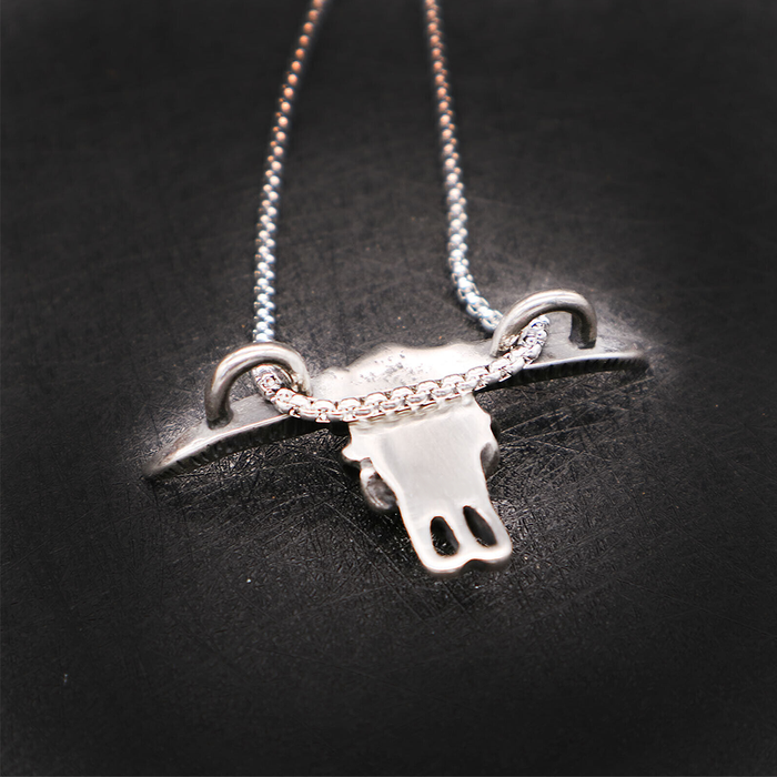 Necklace with Ox Head Pendant: silver, black animal skull/cow skull motif, minimal western-inspired style