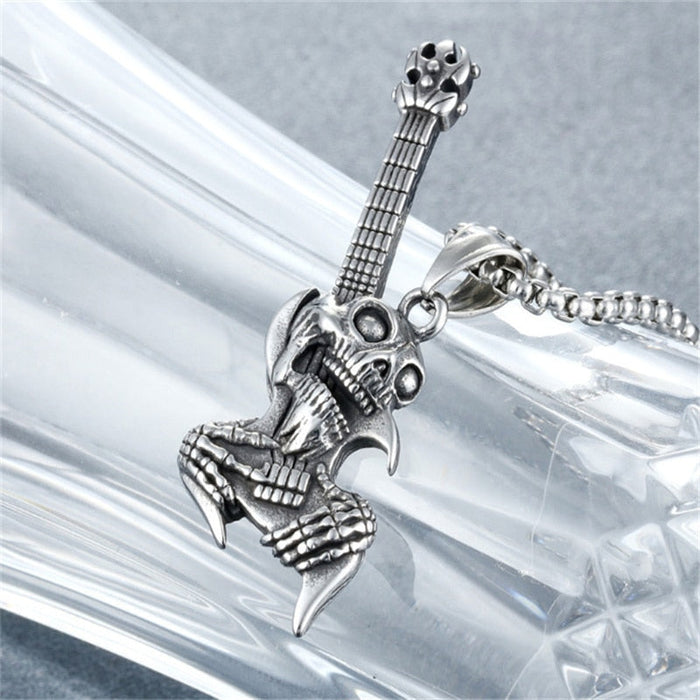 Necklace with Skull Gothic Guitar Design: silver, dark gray skeletal creature/character, gothic cartoon style