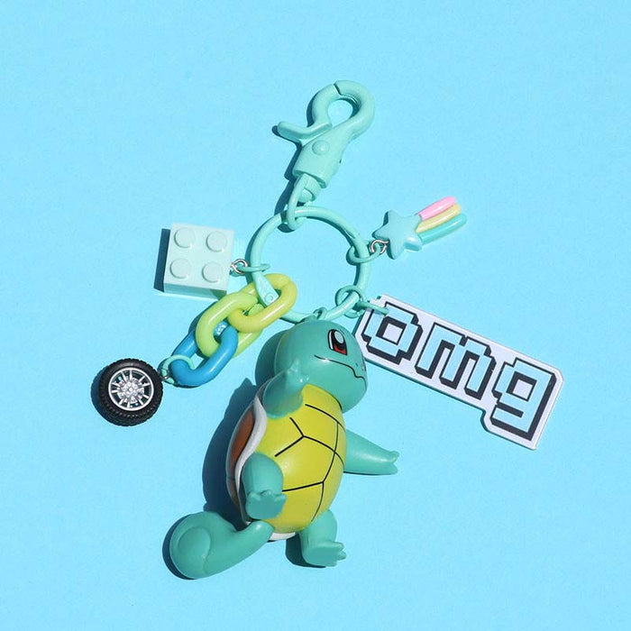 Pokemon Lover Keychain with Accessories: teal, yellow Squirtle-like turtle character, cartoon style