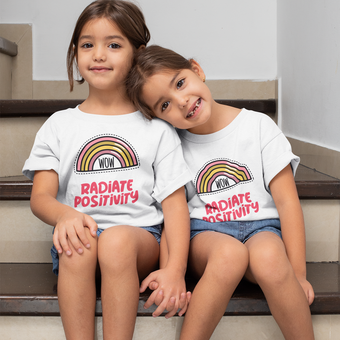 Radiate Positivity T-Shirt for Girls: white, pink rainbow graphic with "WOW" and "RADIATE POSITIVITY" text, cartoon, positive
