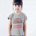 Radiate Positivity T-Shirt for Girls: white, pink rainbow graphic with "WOW" and "RADIATE POSITIVITY" text, cartoon, positive