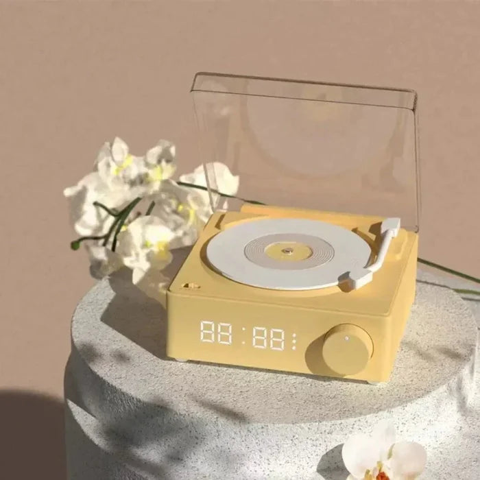 Retro Bluetooth Turntable Speaker with Alarm Clock Functionality: pale yellow, white turntable-style audio player with digita