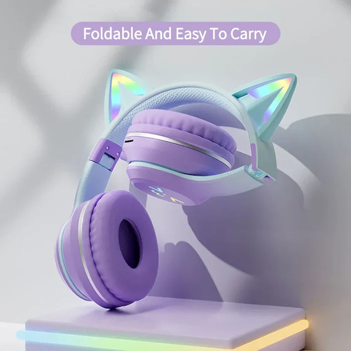 RGB Foldable Bluetooth Headphones with Cat Ear Design: pink, light blue cat-ear character/theme, kawaii cartoon style