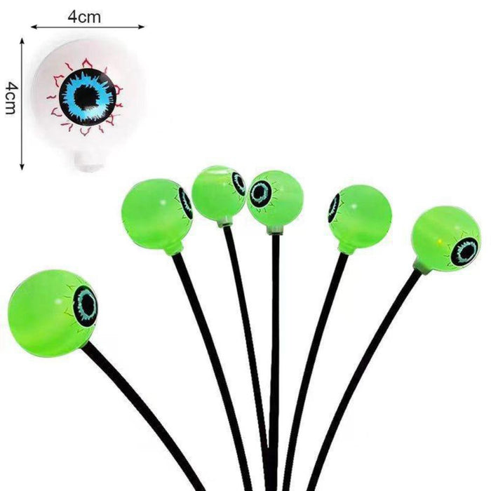 Set of 10 LED Solar Eye Ball Lights for Halloween (2 Packs): neon green, black glowing eyeballs, spooky cartoon style