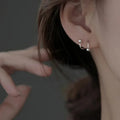 Spiral Earrings with a Delicate Design: silver star, minimal style