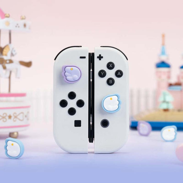 Switch Thumb Grips with Angel Wings: pink, white stylized winged emblem with star, kawaii cartoon style