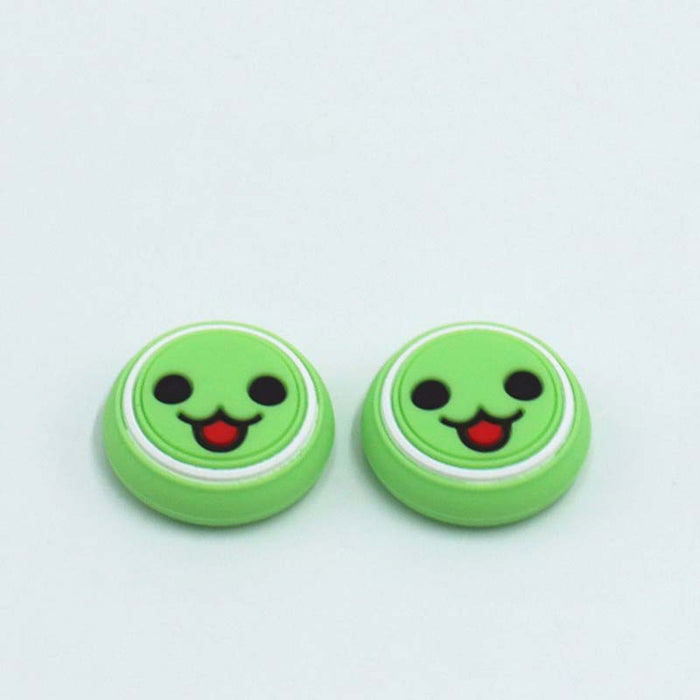 Taiko-inspired Joystick Caps for Gaming Controllers: light green, white smiling cartoon face, kawaii cartoon style