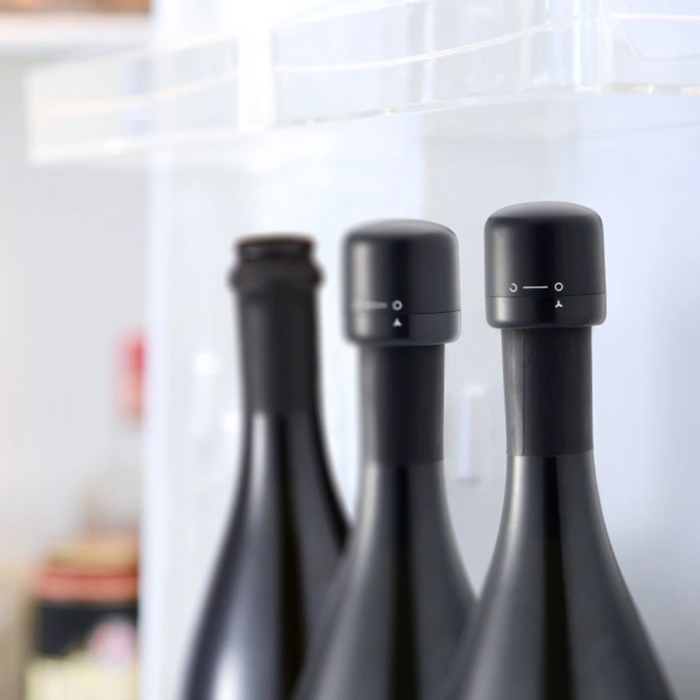 Vacuum Sealed Wine and Champagne Bottle Stopper: black, dark gray rotary latch/cap mechanism, minimal modern style