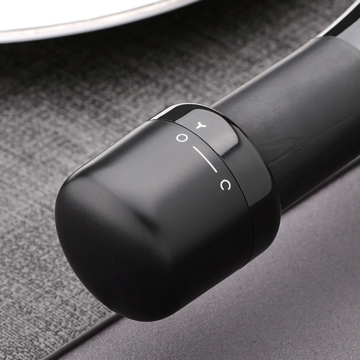 Vacuum Sealed Wine and Champagne Bottle Stopper: black, dark gray rotary latch/cap mechanism, minimal modern style