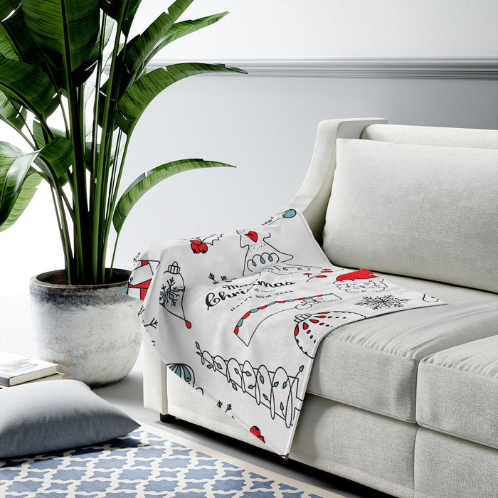Velveteen Plush Blanket with a Festive Holiday Design: white, black festive holiday doodles including snowmen, ornaments, sno