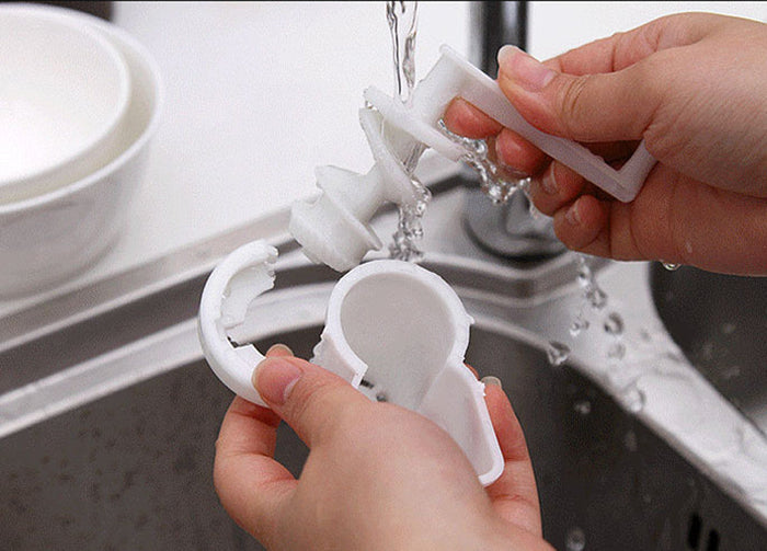 Versatile Garlic and Ginger Mincer 3-in-1: white, silver disassembled white plastic cleaning tool or container parts being ri