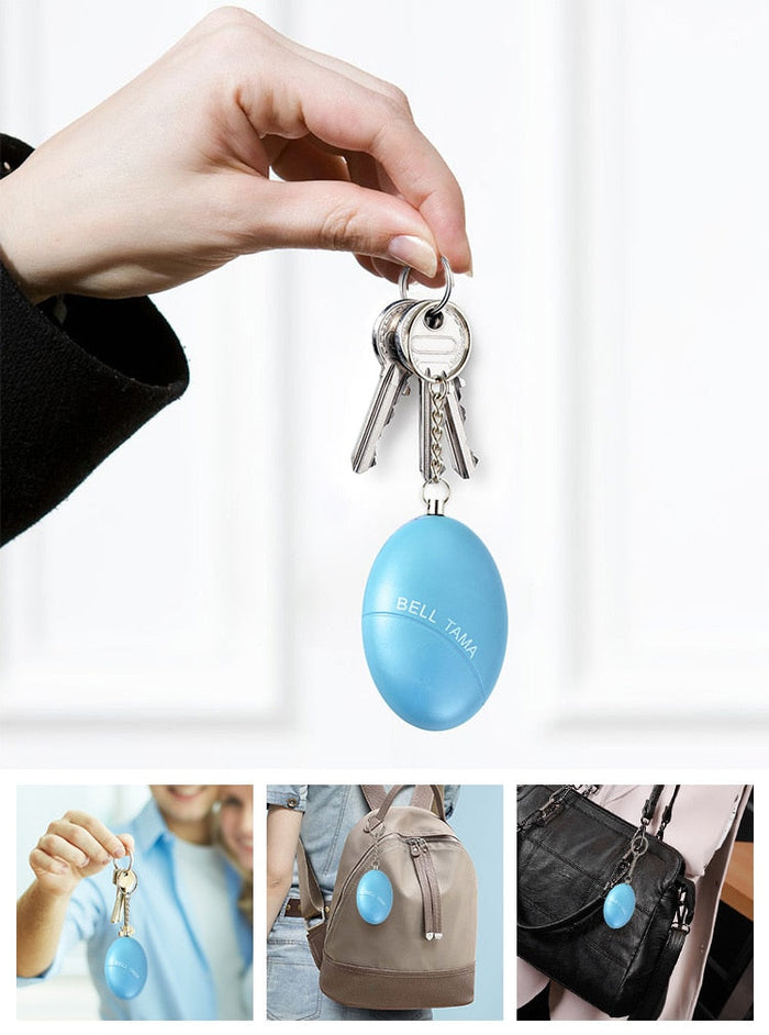 Wearable Personal Security Alert Device: bright blue, silver keychain accessory, minimal style