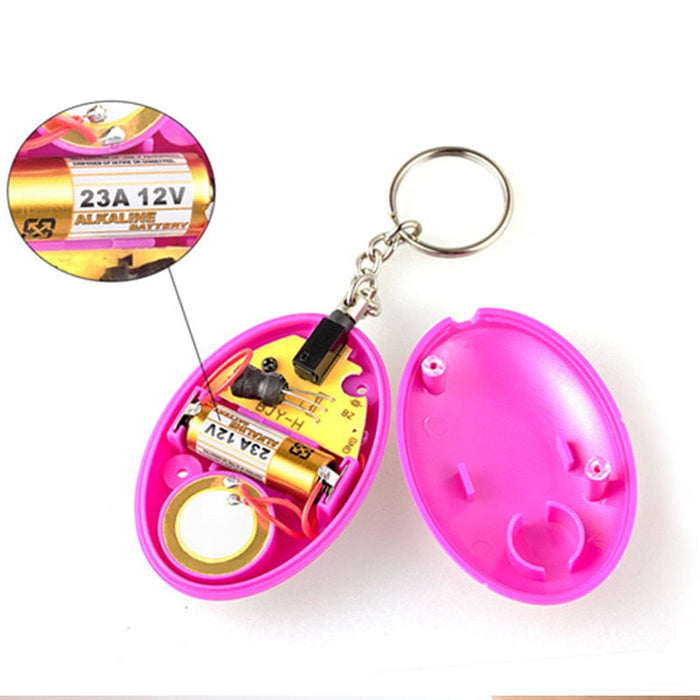 Wearable Personal Security Alert Device: bright blue, silver keychain accessory, minimal style