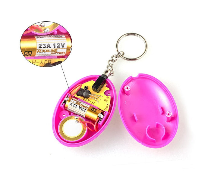 Wearable Personal Security Alert Device: bright blue, silver keychain accessory, minimal style