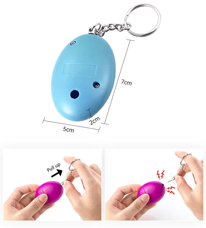 Wearable Personal Security Alert Device: bright blue, silver keychain accessory, minimal style