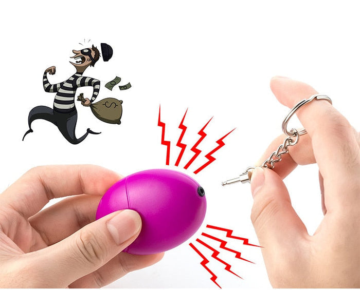 Wearable Personal Security Alert Device: bright blue, silver keychain accessory, minimal style