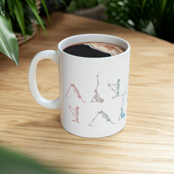 Yoga Poses Skeleton Mug: white, gray human skeletons in yoga poses, minimal graphic style