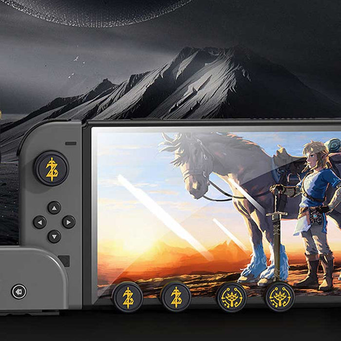 Zelda Joystick Caps with Sheikah Slate: black, gold/yellow stylized symbols/emblems, minimal graphic, game-token-like style