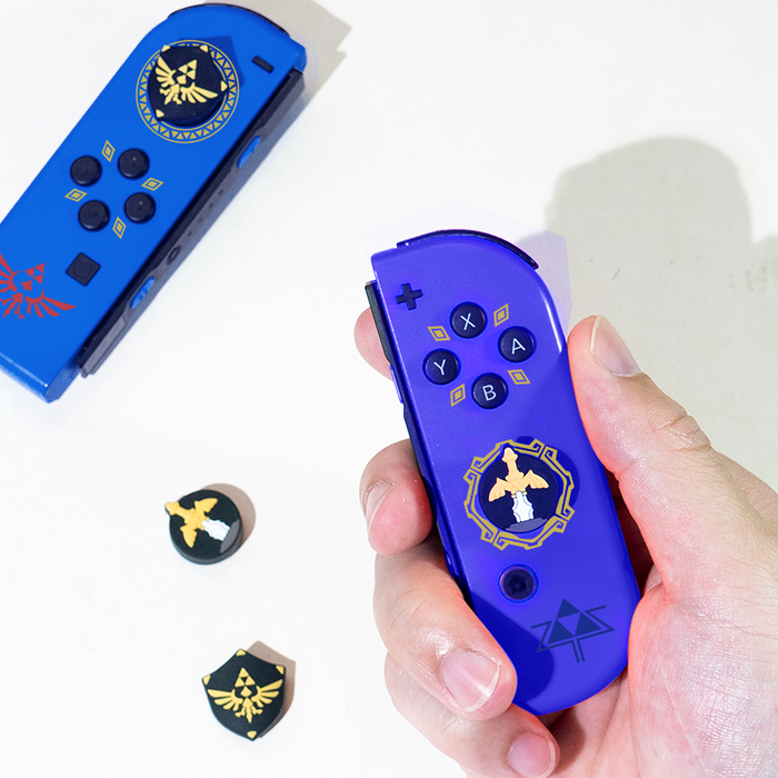 Zelda Thumb Grips: Enhance Gaming Experience: dark gray, black fantasy sword and winged crest emblem, fantasy game-inspired g